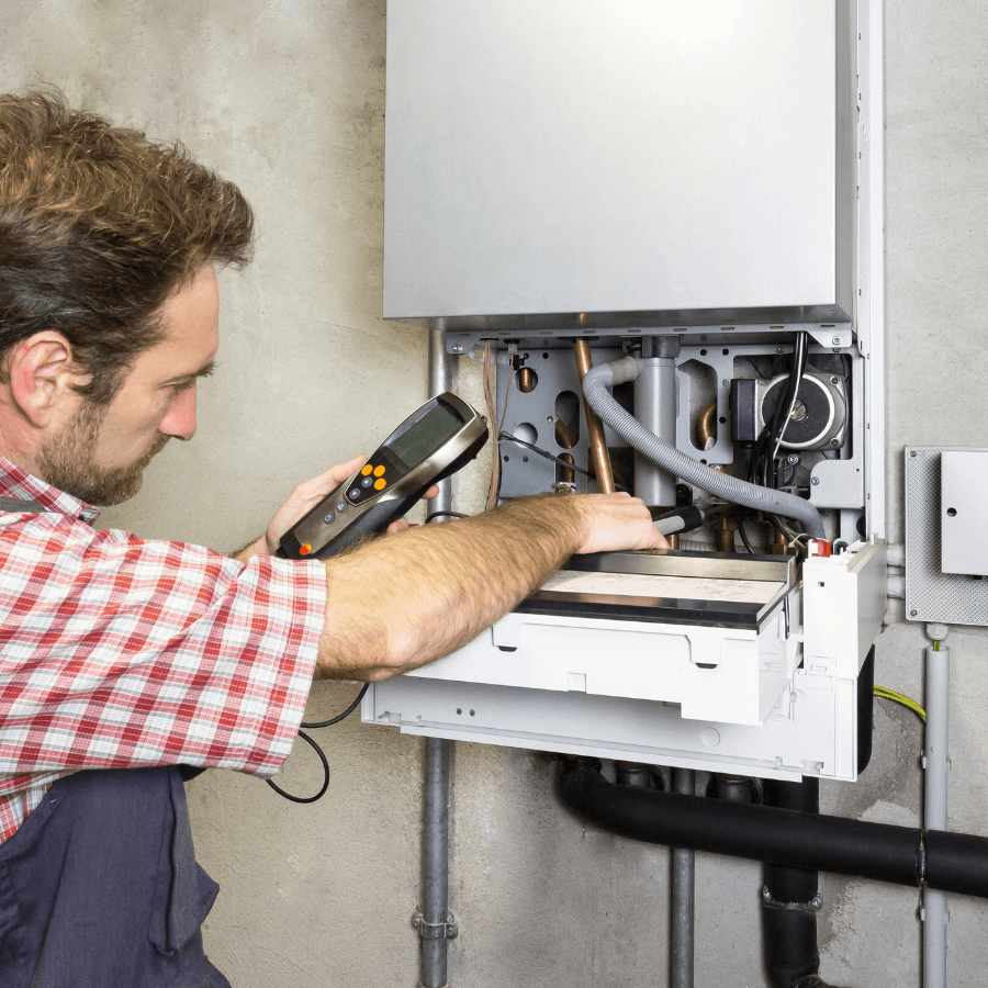 Gas Safe registered engineer testing a gas boiler during a service in Glasgow